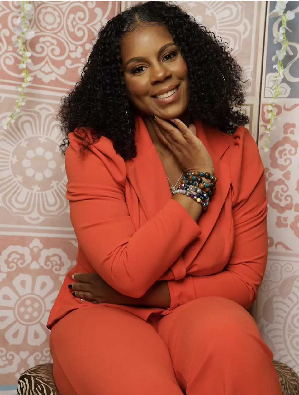Akea Williams, founder and lead counselor, smiling warmly in a sunlit room