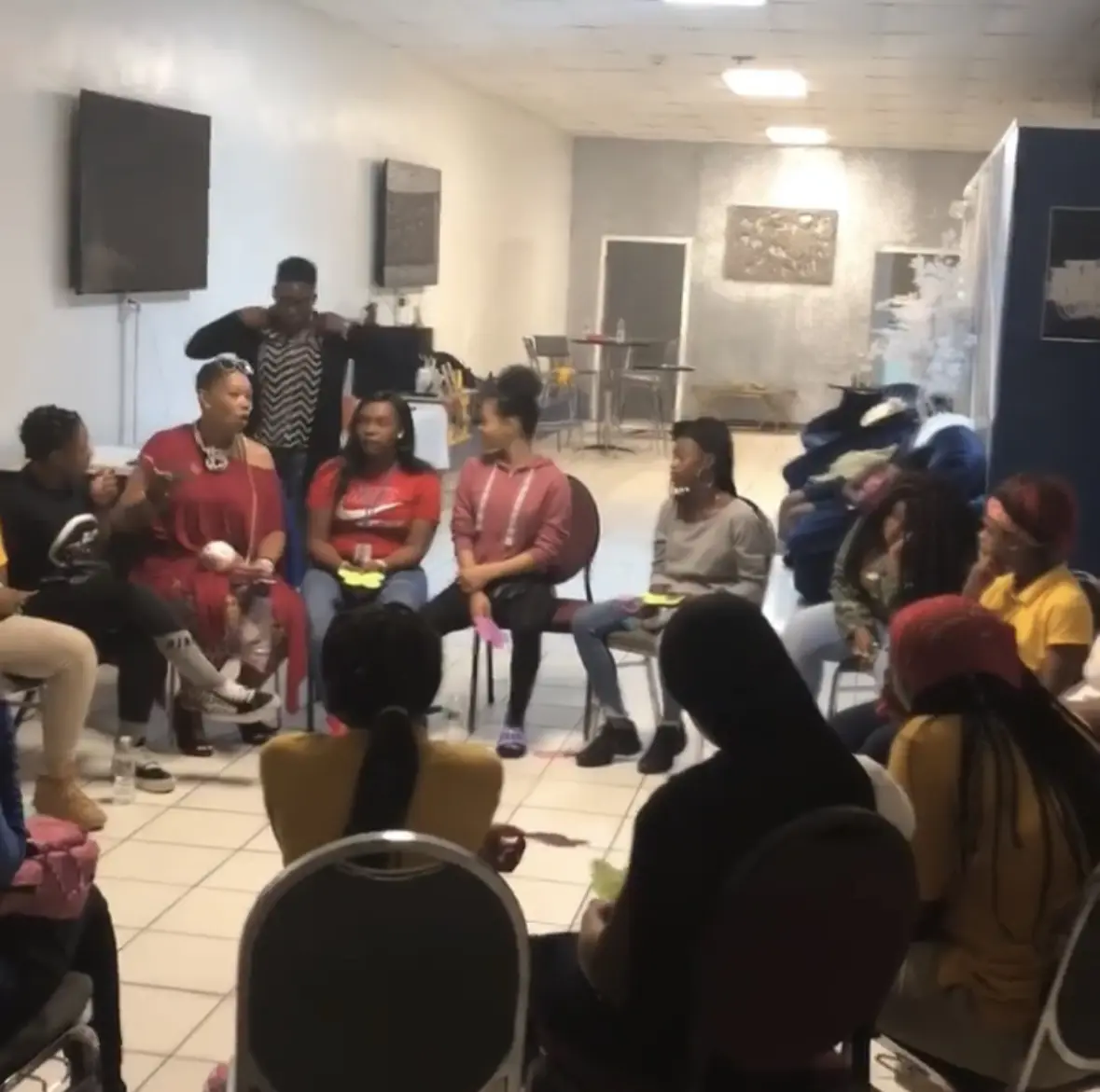 A community mental-health workshop with people gathered in a circle